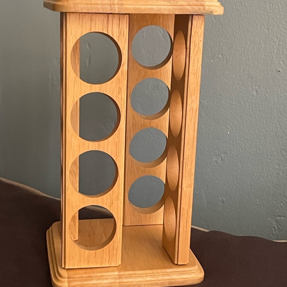 Rotating wooden spice rack designed to hold and organize spice jars